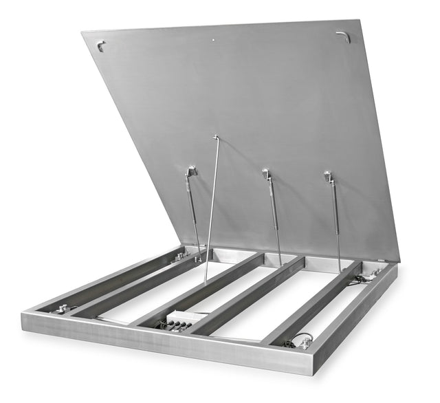 Stainless floor scale with top plate raised, showing frame, load cells and junction box